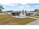 Aerial view of a white mobile home with screened porch at 6305 Parkview Ct, North Port, FL 34287
