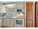 White kitchen with light blue walls and modern appliances at 6305 Parkview Ct, North Port, FL 34287