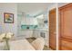 Cozy kitchen featuring white cabinets and a dining area at 6305 Parkview Ct, North Port, FL 34287