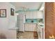 White kitchen with light blue walls and modern appliances at 6305 Parkview Ct, North Port, FL 34287