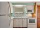 Bright kitchen with white cabinets and appliances at 6305 Parkview Ct, North Port, FL 34287