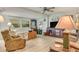 Relaxing living room with comfortable seating and large windows at 6305 Parkview Ct, North Port, FL 34287
