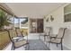 Relaxing screened porch with patio furniture and rug at 6305 Parkview Ct, North Port, FL 34287
