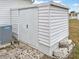 White storage shed with double doors and lock at 6305 Parkview Ct, North Port, FL 34287