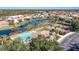 Community pool, tennis courts, and pond view at 632 Balsam Apple Dr, Venice, FL 34293