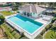 Community pool and clubhouse with tennis courts nearby at 632 Balsam Apple Dr, Venice, FL 34293