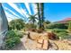 Landscaped backyard with a Japanese garden and wooden bridge at 632 Balsam Apple Dr, Venice, FL 34293