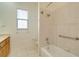 Clean bathroom with tub, shower, and wood vanity at 632 Balsam Apple Dr, Venice, FL 34293