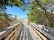 Wooden boardwalk leads to beach access at 632 Balsam Apple Dr, Venice, FL 34293