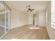 Spacious bedroom with wood-look floors and access to a bathroom at 632 Balsam Apple Dr, Venice, FL 34293