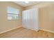 Bright bedroom with wood flooring and a built-in wall bed at 632 Balsam Apple Dr, Venice, FL 34293