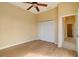 Simple bedroom with wood-look floors and a large closet at 632 Balsam Apple Dr, Venice, FL 34293