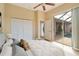Bedroom with pool view, ceiling fan, and large closet at 632 Balsam Apple Dr, Venice, FL 34293