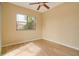 Light and airy bedroom with large window and wood-look floors at 632 Balsam Apple Dr, Venice, FL 34293