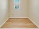 Empty bedroom with light walls and wood flooring at 632 Balsam Apple Dr, Venice, FL 34293