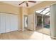 Bedroom with pool view, ceiling fan, and large closet at 632 Balsam Apple Dr, Venice, FL 34293