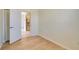 Small bedroom with wood flooring and a view into the kitchen at 632 Balsam Apple Dr, Venice, FL 34293