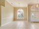 Bright dining area with tile floor and arched window at 632 Balsam Apple Dr, Venice, FL 34293