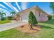 House exterior showcasing garage and landscaping at 632 Balsam Apple Dr, Venice, FL 34293