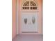 Double front doors with arched window above at 632 Balsam Apple Dr, Venice, FL 34293