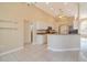 Kitchen features granite countertops, stainless steel appliances, and white cabinets at 632 Balsam Apple Dr, Venice, FL 34293