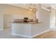 Kitchen boasts granite countertops and stainless steel appliances at 632 Balsam Apple Dr, Venice, FL 34293