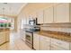 Modern kitchen with stainless steel appliances and granite countertops at 632 Balsam Apple Dr, Venice, FL 34293