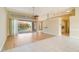 Open concept living space with pool view and kitchen access at 632 Balsam Apple Dr, Venice, FL 34293