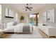 Spacious main bedroom with pool view and wood-look floors at 632 Balsam Apple Dr, Venice, FL 34293