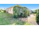 Landscaped side yard with stone pathway at 632 Balsam Apple Dr, Venice, FL 34293