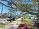 Scenic street view with lush landscaping and ample parking at 632 Balsam Apple Dr, Venice, FL 34293