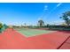 Full-size tennis court with seating area at 632 Balsam Apple Dr, Venice, FL 34293