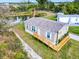 Aerial view of a manufactured home with a deck and water access at 6720 Villaview Dr, Punta Gorda, FL 33982