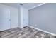 Spacious bedroom with wood-look floors and an adjacent bathroom at 6720 Villaview Dr, Punta Gorda, FL 33982