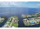 Aerial view showing waterfront home with canal access in a residential area at 258 Beeney Se Rd, Port Charlotte, FL 33952