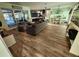 Open concept living and dining area with modern flooring at 258 Beeney Se Rd, Port Charlotte, FL 33952