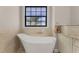 Relaxing bathroom with freestanding soaking tub at 1002 Messina Dr, Punta Gorda, FL 33950