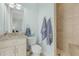 Bathroom with granite countertop, toilet, and walk-in shower at 1002 Messina Dr, Punta Gorda, FL 33950