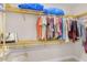 Large walk-in closet with custom shelving and hanging rods at 1002 Messina Dr, Punta Gorda, FL 33950