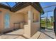 Outdoor kitchen with granite countertop and a built-in refrigerator at 1002 Messina Dr, Punta Gorda, FL 33950