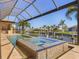 Inviting pool and spa with covered lanai at 1002 Messina Dr, Punta Gorda, FL 33950