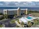 Aerial view of waterfront community with pool and parking at 101 N Marion Ct # 221, Punta Gorda, FL 33950