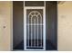 Front door with security screen and tiled entryway at 101 N Marion Ct # 221, Punta Gorda, FL 33950