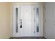 White front door with sidelights and a keypad at 101 N Marion Ct # 221, Punta Gorda, FL 33950