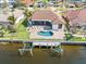 Bird's-eye view of canal-front home with pool and boat lift at 11 Sabal Dr, Punta Gorda, FL 33950