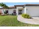 Front view of a single-Gathering home with a two-car garage at 11 Sabal Dr, Punta Gorda, FL 33950