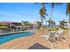 Relaxing pool area with patio furniture, overlooking the canal at 11 Sabal Dr, Punta Gorda, FL 33950