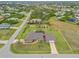 Aerial view of single-Gathering home with pool and large lot at 124 Beau Rivage Dr, Rotonda West, FL 33947