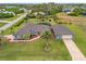 Aerial view of a single-Gathering home with a pool at 124 Beau Rivage Dr, Rotonda West, FL 33947