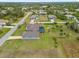 Aerial view of a single-Gathering home with a pool and large backyard at 124 Beau Rivage Dr, Rotonda West, FL 33947